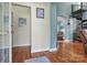 Bright entryway with hardwood floors and spiral staircase at 20109 Norman Colony Rd, Cornelius, NC 28031