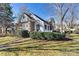 Brick ranch home with a white porch and landscaped yard at 20109 Norman Colony Rd, Cornelius, NC 28031