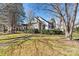 Brick ranch home with a white porch and landscaped yard at 20109 Norman Colony Rd, Cornelius, NC 28031