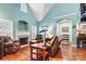 Living room with vaulted ceilings, hardwood floors, and fireplace at 20109 Norman Colony Rd, Cornelius, NC 28031