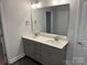 Double vanity bathroom with gray cabinets and a large mirror at 403 Imperial Way # 24, Albemarle, NC 28001
