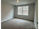 Well-lit bedroom with a large window and neutral decor at 403 Imperial Way # 24, Albemarle, NC 28001