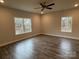 Large bedroom with hardwood floors and multiple windows at 403 Imperial Way # 24, Albemarle, NC 28001