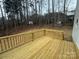 Wooden deck with view of treeline and houses at 403 Imperial Way # 24, Albemarle, NC 28001