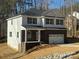 Two-story home with brick and white siding, a large garage, and a front porch at 403 Imperial Way # 24, Albemarle, NC 28001