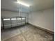 Spacious garage with overhead storage and freshly painted walls at 403 Imperial Way # 24, Albemarle, NC 28001