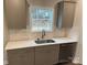 Kitchen features gray cabinets, white subway tile, and stainless steel sink at 403 Imperial Way # 24, Albemarle, NC 28001