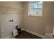 Bright laundry room, featuring shelving and vinyl flooring at 403 Imperial Way # 24, Albemarle, NC 28001