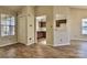 Spacious, light-filled living room with wood floors and kitchen access at 6125 Gray Gate Ln # F, Charlotte, NC 28210