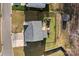 Aerial view of a home with a spacious backyard, wooden deck, play set, shed, and fenced in yard at 7520 Berkeley W Rd, Denver, NC 28037