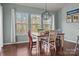 Bright dining room with wood table and large windows at 7520 Berkeley W Rd, Denver, NC 28037