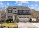 Charming two-story home with a well-maintained lawn, a two-car garage, and attractive curb appeal at 7520 Berkeley W Rd, Denver, NC 28037