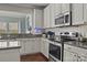 Updated kitchen with stainless steel appliances and granite counters at 7520 Berkeley W Rd, Denver, NC 28037