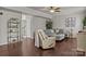 Comfortable living room featuring hardwood floors, stylish furniture, and bright natural light at 7520 Berkeley W Rd, Denver, NC 28037