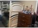 Functional bedroom with a white bunk bed, dresser, and personal items, creating a cozy and organized space at 941 10Th St # 3, Lancaster, SC 29720