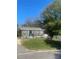 Charming one story home featuring a cozy porch with colorful decorations and a well-maintained front yard at 941 10Th St # 3, Lancaster, SC 29720