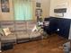 Inviting living room with comfortable seating, a desk, and motivational wall decor, creating a cozy and inspiring space at 941 10Th St # 3, Lancaster, SC 29720