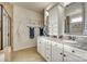Bathroom with double sink vanity and granite countertops with framed mirrors at 1035 Crescent Moon Dr, Fort Mill, SC 29715