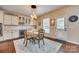 Cozy dining area with an elegant light fixture and ample natural light near the kitchen at 1035 Crescent Moon Dr, Fort Mill, SC 29715