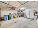 Spacious garage with overhead storage racks and ample room for parking and projects at 1035 Crescent Moon Dr, Fort Mill, SC 29715