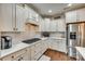 Well-lit kitchen featuring gas range, stainless steel refrigerator, and bright counters at 1035 Crescent Moon Dr, Fort Mill, SC 29715