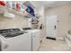 Laundry room with washer, dryer, shelving, and storage space offers convenience and functionality at 1035 Crescent Moon Dr, Fort Mill, SC 29715