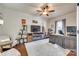 Bright office featuring built-in shelving, a comfortable chair, and a ceiling fan at 1035 Crescent Moon Dr, Fort Mill, SC 29715
