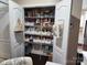 Well-organized pantry with white wire shelves and storage baskets provides ample space for food and household supplies at 1035 Crescent Moon Dr, Fort Mill, SC 29715