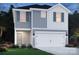 Two-story house with gray and white siding, two-car garage, and landscaping at 212 Alden Ct, Shelby, NC 28152