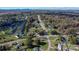 Aerial view of a home in a community surrounded by mature trees and picturesque landscapes near winding roads at 2216 Lowell Bethesda Rd, Gastonia, NC 28056