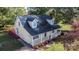 Attractive yellow home showcases dormer windows, red shutters, a front porch and a backyard deck at 2216 Lowell Bethesda Rd, Gastonia, NC 28056