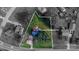 Aerial view of a single-Gathering home, partially black and white, with outlined property lines and landscaped front yard at 2216 Lowell Bethesda Rd, Gastonia, NC 28056