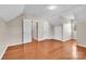 Open bedroom featuring hardwood floors, neutral walls, natural light and angled ceilings at 2216 Lowell Bethesda Rd, Gastonia, NC 28056