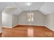 Empty bedroom featuring hardwood floors, neutral walls, natural light and angled ceilings at 2216 Lowell Bethesda Rd, Gastonia, NC 28056