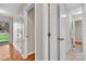 Inviting hallway showcasing hardwood and tile floors, offering a warm welcome into various rooms of the house at 2216 Lowell Bethesda Rd, Gastonia, NC 28056
