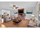 Cozy living room with brick fireplace, neutral paint, plush seating, and decorative accents at 2216 Lowell Bethesda Rd, Gastonia, NC 28056