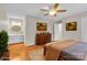 Comfortable bedroom layout with ensuite bath, a wooden dresser, and a plush bed for an inviting ambiance at 2216 Lowell Bethesda Rd, Gastonia, NC 28056