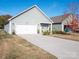 Spacious two-car garage with a concrete driveway and partial view of the house at 280 Kerri Dawn Ln, Locust, NC 28097