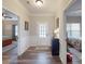 Hallway with wood floors leading to a bedroom and living room area at 280 Kerri Dawn Ln, Locust, NC 28097
