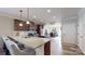 Bright, modern kitchen with a large island, dark cabinets, and stainless steel appliances at 280 Kerri Dawn Ln, Locust, NC 28097
