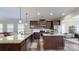 Updated kitchen featuring dark wood cabinets, stainless steel appliances, and a center island at 280 Kerri Dawn Ln, Locust, NC 28097