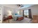 Spacious main bedroom featuring a ceiling fan, modern decor, and natural light from the window at 280 Kerri Dawn Ln, Locust, NC 28097