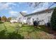 Well-manicured backyard with lush green lawn and gray siding at 284 Garnet Ct, Fort Mill, SC 29708