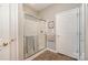 Bathroom with shower including sliding glass door, neutral tile and color scheme, and white door at 284 Garnet Ct, Fort Mill, SC 29708