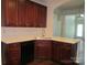Well-appointed kitchen featuring a sink with counterspace and dark wood cabinetry at 284 Garnet Ct, Fort Mill, SC 29708