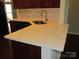 Kitchen island with a sink and white countertops at 284 Garnet Ct, Fort Mill, SC 29708