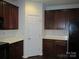 A view of the kitchen appliances, cabinets and a door that leads outside at 284 Garnet Ct, Fort Mill, SC 29708