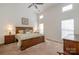 Vaulted ceilings and natural light fill this main bedroom with paneled wood bed frame and matching bedside tables at 284 Garnet Ct, Fort Mill, SC 29708