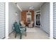 Inviting covered front porch with neutral furniture, ceiling fan, and brick accents at 284 Garnet Ct, Fort Mill, SC 29708
