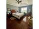 Well-lit bedroom with hardwood floors and ceiling fan at 328 Holstein Dr, Dallas, NC 28034